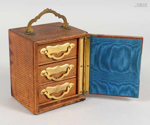 A SMALL LEATHER CASKET, with three drawers, SILVER, GOLD and NOTES. 5.5ins high.