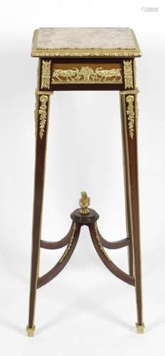 An early 20th century mahogany torcheré,