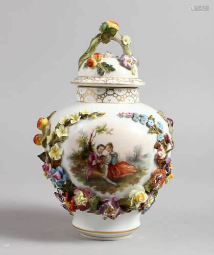 A VIENNA STYLE PORCELAIN LIDDED VASE, applied with floral decoration. 9.75ins high.