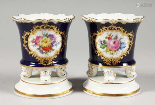 A SMALL PAIR OF MEISSEN PORCELAIN VASES, rich blue ground with vignettes of flowers, the bases