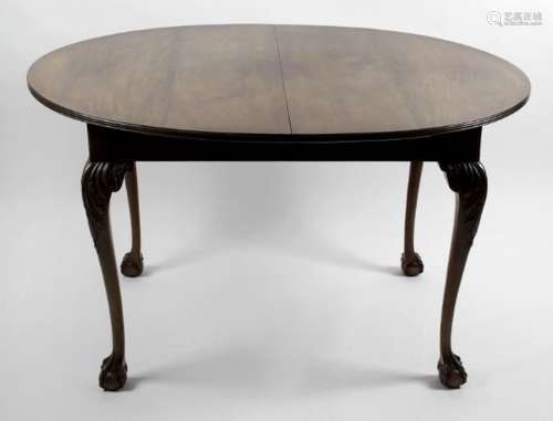 A late 19th century oval topped wind out extending dining room table,