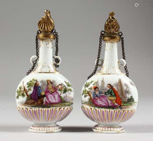 A GOOD SMALL PAIR OF 18TH CENTURY MEISSEN SCENT BOTTLES, painted with scenes of young lovers.