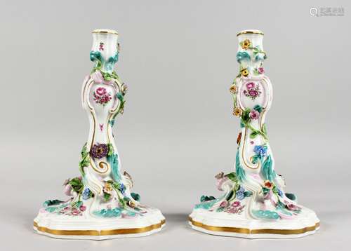 A GOOD PAIR OF MEISSEN FLOWER ENCRUSTED CANDLESTICKS with scrolls. Cross swords mark in blue. 9.5ins