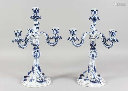 A LARGE PAIR OF MEISSEN PORCELAIN BLUE AND WHITE CANDELABRA, each with three scrolling branches.