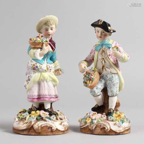 A PAIR OF 19TH CENTURY DERBY FIGURES, a young boy and girl, each holding a basket of flowers. 6ins