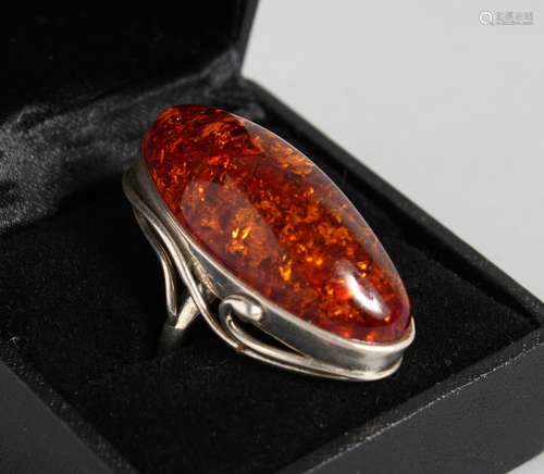 A LARGE AMBER BRACELET AND RING.