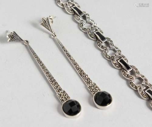 A SILVER MARCASITE ONYX SET BRACELET and PAIR OF DROP EARRINGS.