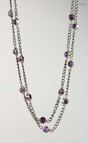 A SILVER AMETHYST SET LONG CHAIN.