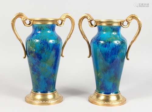 A GOOD PAIR OF 19TH CENTURY SEVRES BLUE PORCELAIN VASE, with ormolu handles and bases. 13ins high.