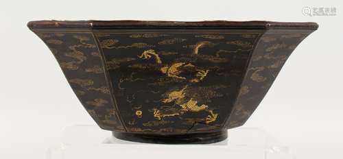 A CHINESE GILT DECORATED LACQUER BOWL. 9ins wide.