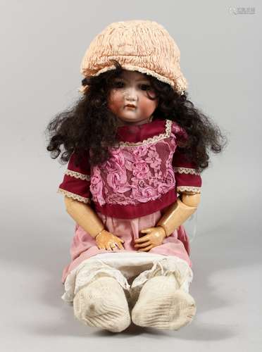 ARMAND MARSEILLE A LARGE GIRL DOLL, with porcelain head and segmented body. Stamped AIIM.