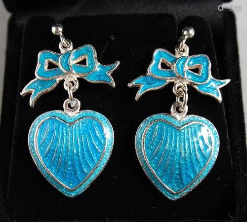 A PAIR OF SILVER AND BLUE ENAMEL HEART AND BOW EARRINGS.