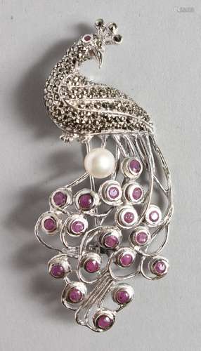 A SILVER, RUBY, PEARL AND MARCASITE PEACOCK BROOCH.