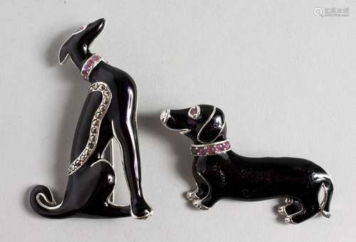 TWO SILVER AND BLACK ENAMEL DOG BROOCHES.