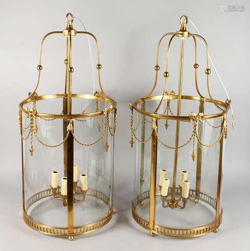 A LARGE PAIR OF BRASS HALL LANTERNS in the Georgian style. 32ins high.