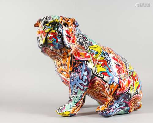 A GRAFFITI DECORATED SEATED BULLDOG.