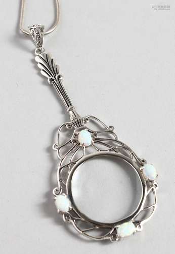 A SILVER OPAL SET SPY GLASS on a chain.