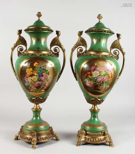 A PAIR OF ORMOLU MOUNTED CLASSICAL STYLE PORCELAIN TWIN-HANDLED VASES, decorated with flowers. 25ins