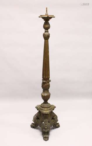 A LARGE, CONTINENTAL CARVED AND PAINTED CHURCH STYLE CANDLE OR LAMP BASE. 5ft 2ins high.
