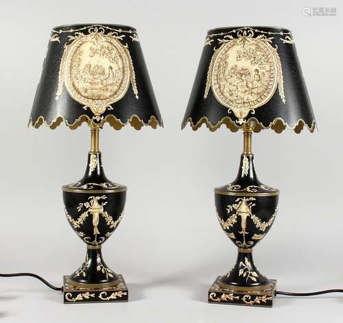 A PAIR OF BLACK TOLEWARE STYLE URN SHAPED LAMPS AND BASES. 22ins high.