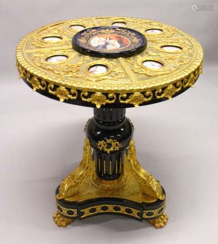 AN IMPRESSIVE EBONISED AND ORMOLU MOUNTED CIRCULAR PEDESTAL TABLE, inset with Sevres style oval
