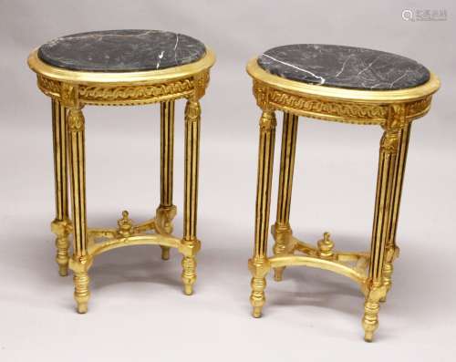 A PAIR OF FRENCH STYLE GILTWOOD ND MARBLE TOP OVAL LAMP TABLES. 2ft 5ins high x 1ft 8ins wide x