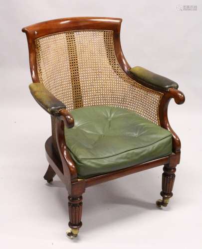 A GOOD REGENCY MAHOGANY BERGERE LIBRARY ARMCHAIR, of typical form, with green leather upholstered