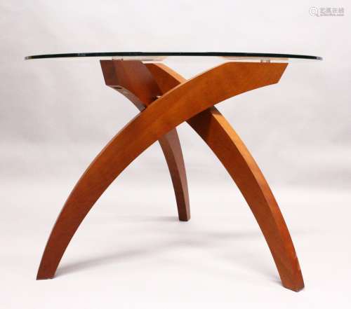TABLEMAKERS of WIMBLEDON, LONDON, A BALLERINA TABLE, with three curving cherry wood legs, united
