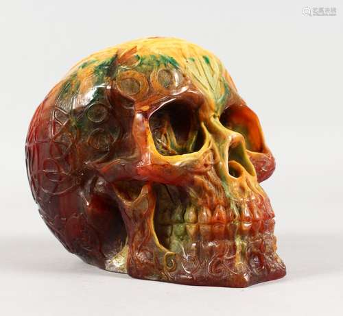 A RESIN SKULL. 5ins high.