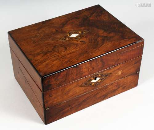 A VICTORIAN WALNUT WRITING BOX, with hinged lid and writing slope. 11.75ins wide.