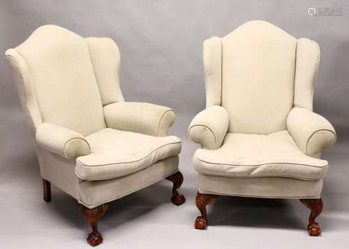 A GOOD PAIR OF GEORGE III DESIGN WING ARMCHAIRS, plain beige upholstery, on carved cabriole legs