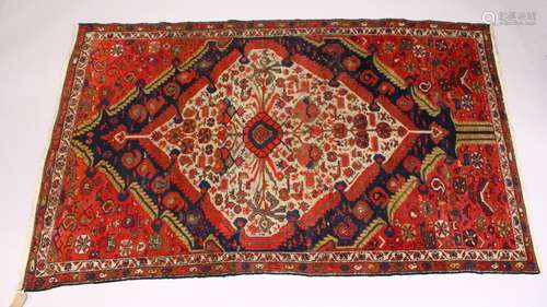 A GOOD SMALL PERSIAN RUG, MID 20TH CENTURY, beige ground with stylised Boteh, birds and flowers. 6ft