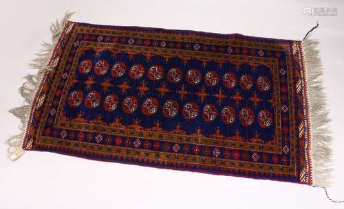 A MODERN BOKHARA STYLE RUG, rich blue ground with two rows of eleven gulls. 6ft 0ins x 3ft 4ins.