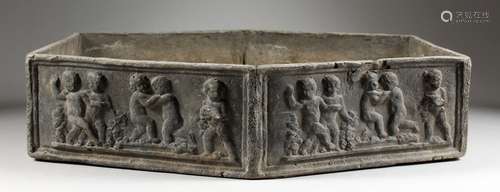 A SMALL LEAD PLANTER, of flattened hexagonal form, the sides depicting cherubs. 19.5ins long x 16ins