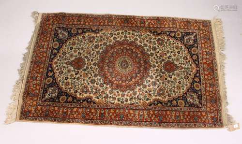 A SMALL KASHAN RUG, 20th Century beige ground with floral decoration, with a similar rust ground