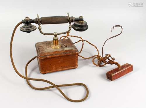 A VINTAGE ERICSSON TELEPHONE, with Bakelite handle, brass stand and wooden base.