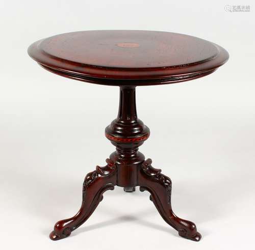 A VERY GOOD APPRENTICES MAHOGANY TILT TOP TRIPOD TABLE, on carved tripod legs. 12ins diameter.