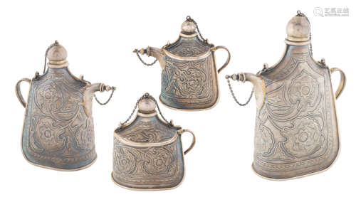 AN EXCEPTIONAL SET OF FOUR RUSSIAN SILVER TROMPE L'OEIL PILGRIM FLASKS FOR TIFFANY & CO., NEMIROV-KO