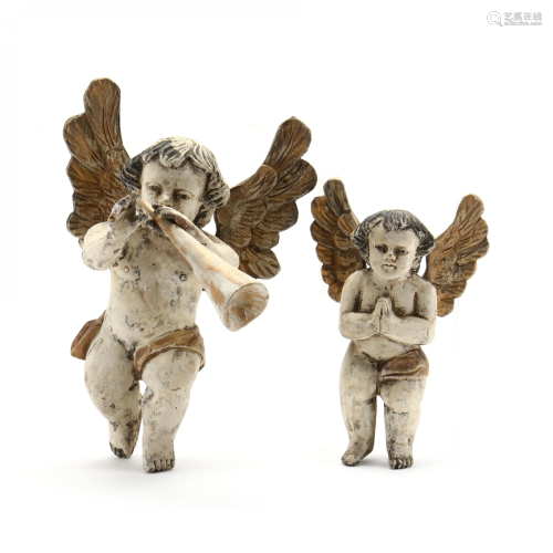 A Pair of Carved and Polychrome Painted Cherubs