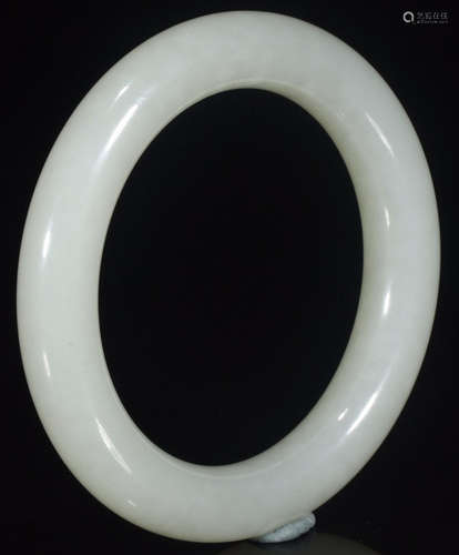 A HETIAN JADE CARVED BANGLE