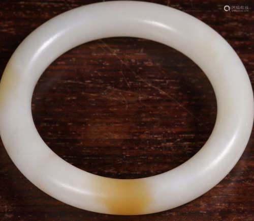 A HETIAN JADE CARVED BANGLE