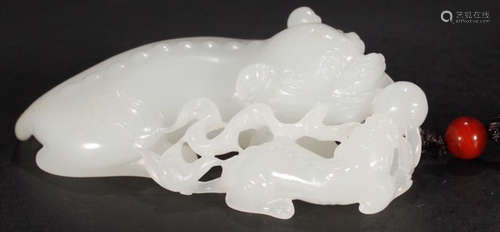 A HETIAN JADE CARVED BEAST SHAPED PENDANT