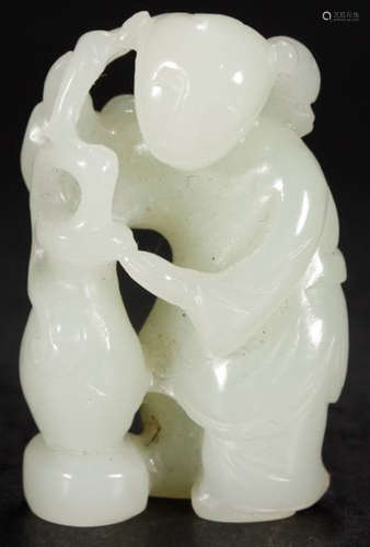 A HETIAN JADE CARVED KID SHAPED PENDANT