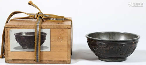 A COCONUT SHELL WITH TIN BOWL