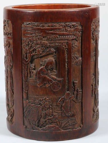 A BAMBOO CARVED FIGURE SHAPED BRUSH POT