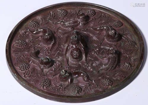 A BRONZE CASTED MIRROR