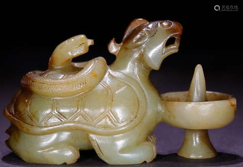 A HETIAN JADE CARVED BEAST SHAPED CANDLE HOLDER