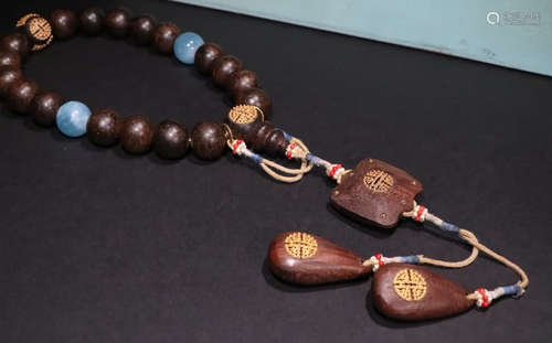 A CHENXIANG WOOD STRING BRACELET