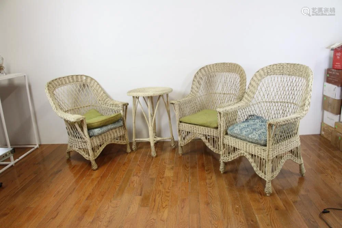 Three Wicker Chairs and a Table