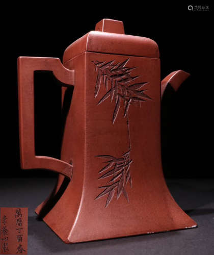 A ZISHA TEA POT CARVED WITH BAMBOO PATTERN